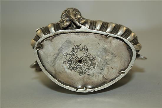 An unusual Tibetan silver seated figure of Green Tara, possibly 19th century, 11.7cm